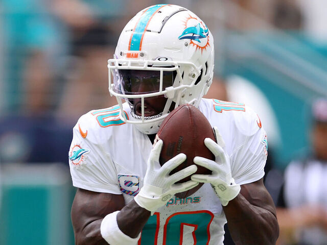MIAMI GARDENS, FLORIDA - OCTOBER 08: Tyreek Hill #10 of the Miami Dolphins runs the ball against the New York Giants during the first quarter at Hard Rock Stadium on October 08, 2023 in Miami Gardens, Florida.