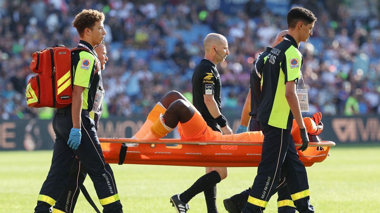 Clermont-Ferrand's French goalkeeper #99 Mory Diaw injured by a firecracker, is evacuated on a stretcher during the French L1 football match between Montpellier Herault SC and Clermont Foot 63 at Stade de la Mosson in Montpellier, southern France on October 8, 2023.