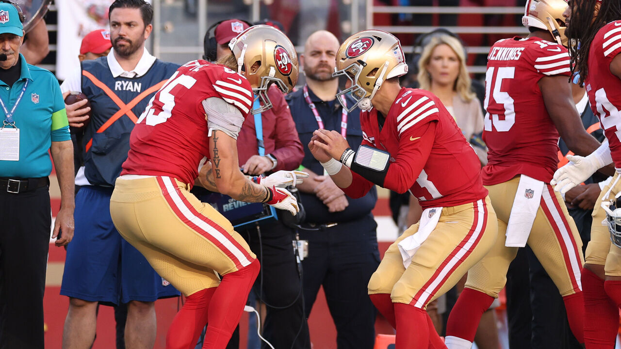 SANTA CLARA, CALIFORNIA - OCTOBER 08: George Kittle #85 of the San Francisco 49ers celebrates with Brock Purdy #13 after a touchdown during the first quarter against the Dallas Cowboys at Levi's Stadium on October 08, 2023 in Santa Clara, California.