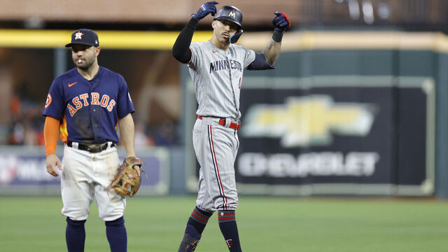 HOUSTON, TEXAS - OCTOBER 08: Carlos Correa #4 of the Minnesota Twins celebrates his double against the Houston Astros during the seventh inning in Game Two of the Division Series at Minute Maid Park on October 08, 2023 in Houston, Texas.