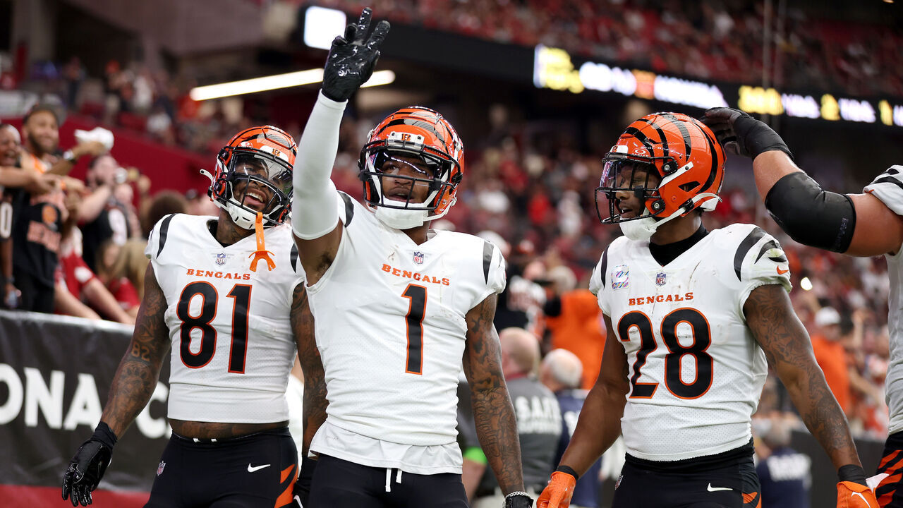 GLENDALE, ARIZONA - OCTOBER 08: Ja'Marr Chase #1 of the Cincinnati Bengals celebrates a touchdown with teammates Joe Mixon #28 and Irv Smith Jr. #81 against the Arizona Cardinals during the first quarter at State Farm Stadium on October 08, 2023 in Glendale, Arizona.