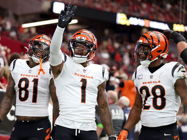 GLENDALE, ARIZONA - OCTOBER 08: Ja'Marr Chase #1 of the Cincinnati Bengals celebrates a touchdown with teammates Joe Mixon #28 and Irv Smith Jr. #81 against the Arizona Cardinals during the first quarter at State Farm Stadium on October 08, 2023 in Glendale, Arizona.