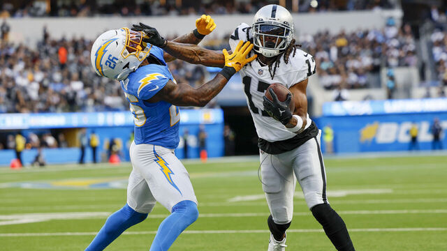 Inglewood, CA, Sunday, October 1, 2023 - TLas Vegas Raiders wide receiver Davante Adams (17) stiff arms Los Angeles Chargers cornerback Asante Samuel Jr. (26) during a third quarter drive at SoFi Stadium. (Robert Gauthier/Los Angeles Times via Getty Images)