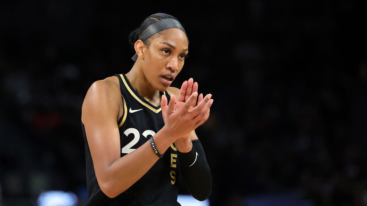 LAS VEGAS, NEVADA - OCTOBER 08: A'ja Wilson #22 of the Las Vegas Aces claps after the New York Liberty called a timeout in the third quarter of Game One of the 2023 WNBA Playoffs finals at Michelob ULTRA Arena on October 08, 2023 in Las Vegas, Nevada.