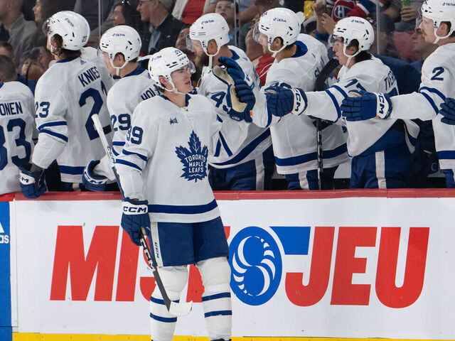 MONTREAL, QC - SEPTEMBER 30: Fraser Minten (39) of the Toronto Maple Leafs celebrates with teammates after scoring a goal during the second period of the NHL pre-season game between the Toronto Maple Leafs and the Montreal Canadiens on September 30, 2023, at the Bell Centre in Montreal, QC