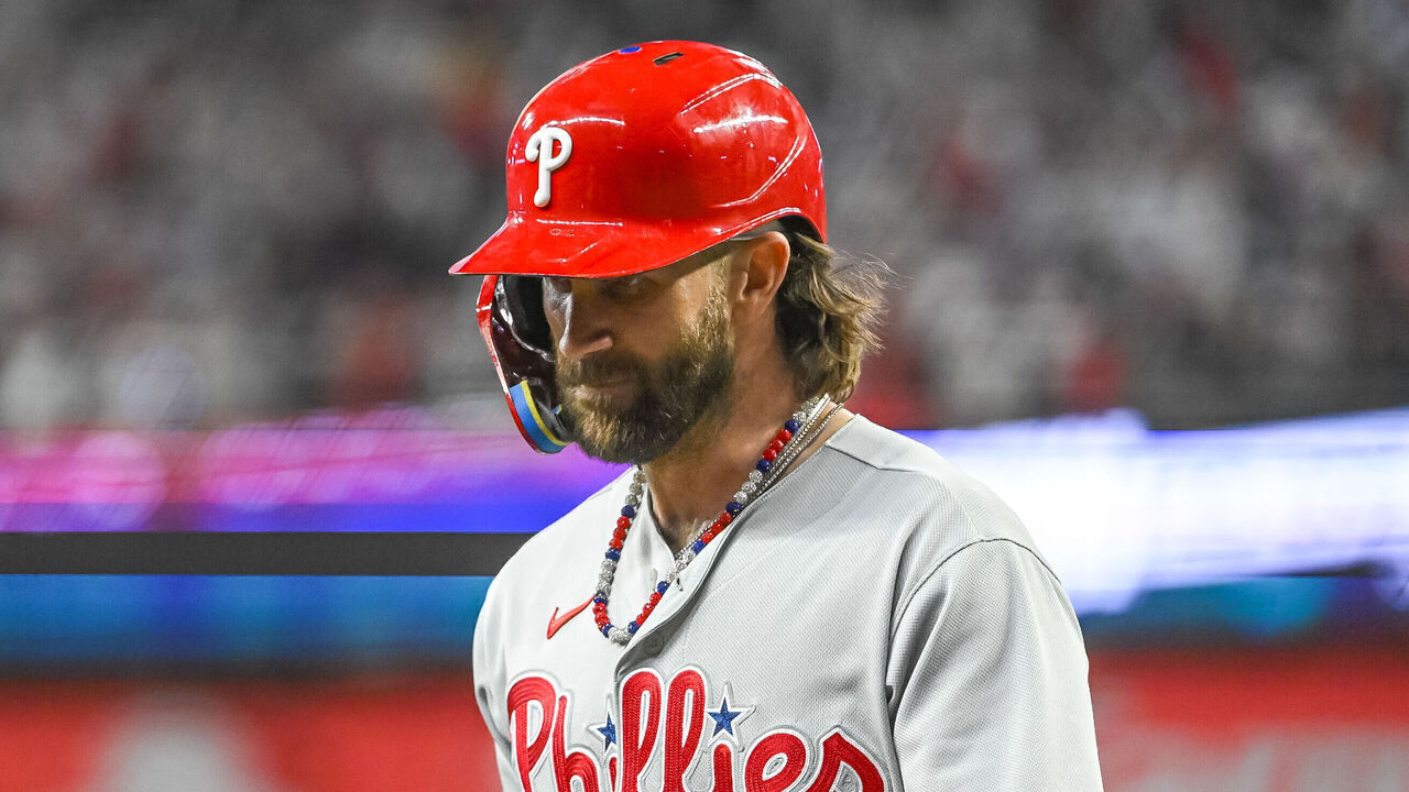ATLANTA, GA - OCTOBER 09: Philadelphia Phillies first baseman Bryce Harper (3) walks off the field dejected after losing game 2 of the NLDS between the Philadelphia Phillies and Atlanta Braves on October 9, 2023, at Truist Park in Atlanta, GA.