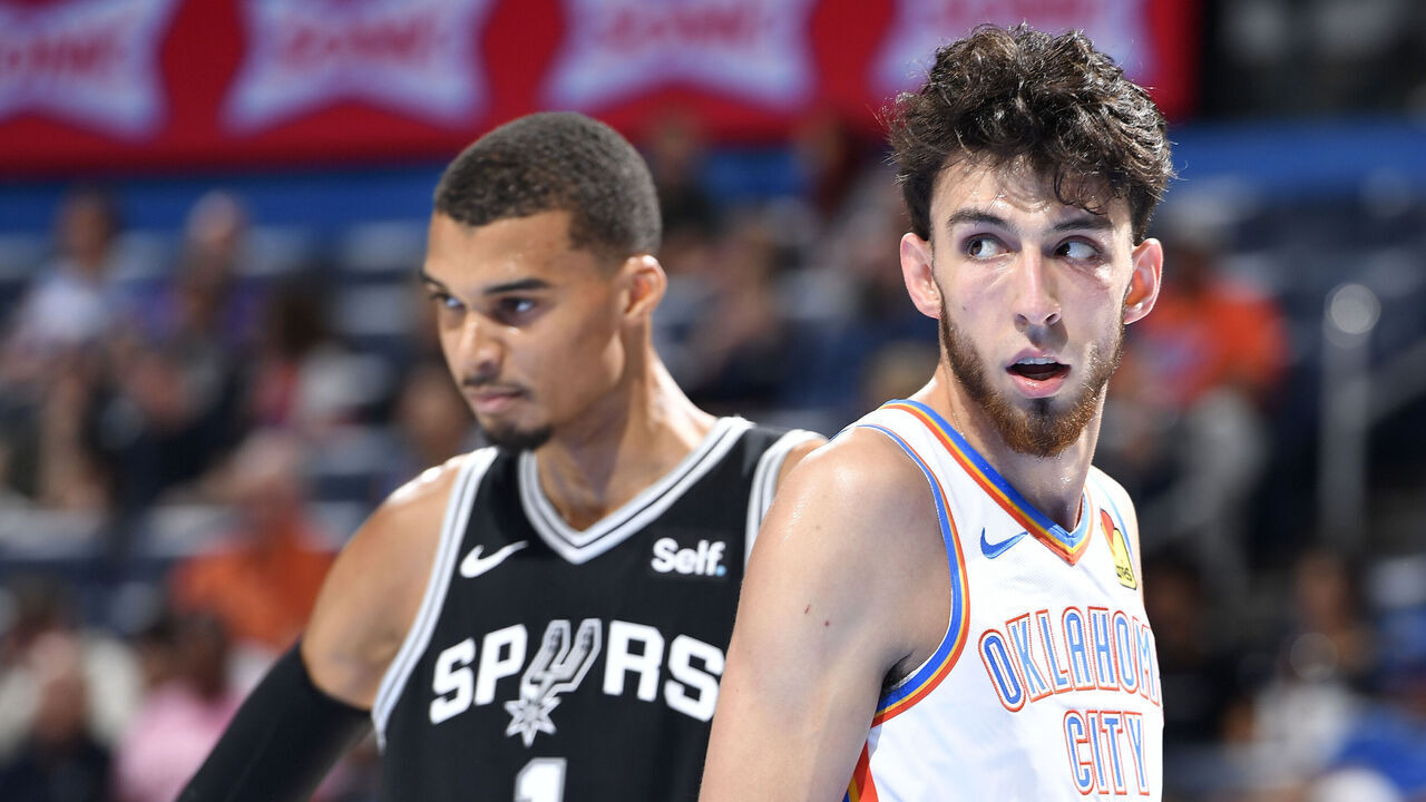 OKLAHOMA CITY, OK - OCTOBER 9: Chet Holmgren #7 of the Oklahoma City Thunder and Victor Wembanyama #1 of the San Antonio Spurs look on during the game on October 9, 2023 at the Paycom Center in Oklahoma City, OK. Mandatory Copyright Notice: Copyright 2023 NBAE