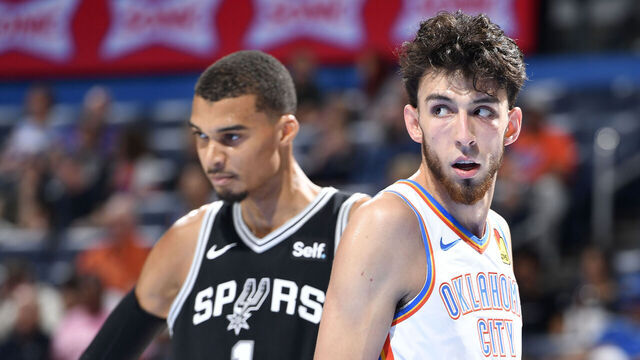 OKLAHOMA CITY, OK - OCTOBER 9: Chet Holmgren #7 of the Oklahoma City Thunder and Victor Wembanyama #1 of the San Antonio Spurs look on during the game on October 9, 2023 at the Paycom Center in Oklahoma City, OK. Mandatory Copyright Notice: Copyright 2023 NBAE