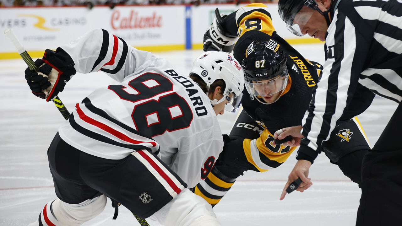 PITTSBURGH, PENNSYLVANIA - OCTOBER 10: Connor Bedard #98 of the Chicago Blackhawks faces off against Sidney Crosby #87 of the Pittsburgh Penguins during the second period at PPG PAINTS Arena on October 10, 2023 in Pittsburgh, Pennsylvania.