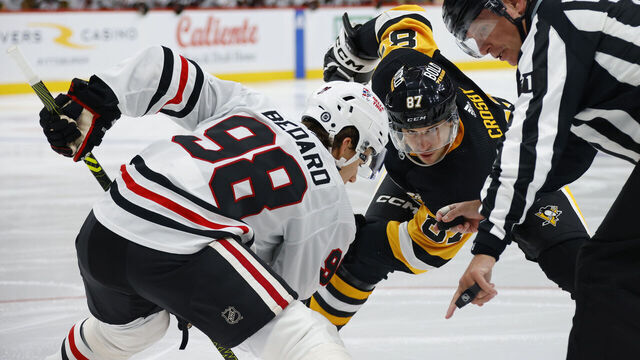 PITTSBURGH, PENNSYLVANIA - OCTOBER 10: Connor Bedard #98 of the Chicago Blackhawks faces off against Sidney Crosby #87 of the Pittsburgh Penguins during the second period at PPG PAINTS Arena on October 10, 2023 in Pittsburgh, Pennsylvania.