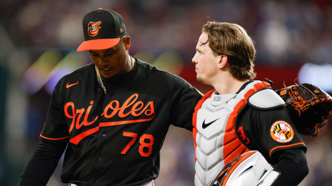ARLINGTON, TX - OCTOBER 10: Yennier Cano #78 of the Baltimore Orioles greets Adley Rutschman #35 in the eighth inning during Game 3 of the Division Series between the Baltimore Orioles and the Texas Rangers at Globe Life Field on Tuesday, October 10, 2023 in Arlington, Texas.