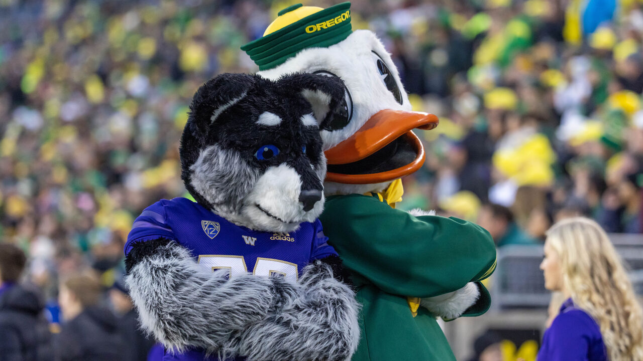 EUGENE, OR - NOVEMBER 12: Puddles the mascot of the Oregon Ducks cheers against the Washington Huskies at Autzen Stadium on November 12, 2022 in Eugene, Oregon.