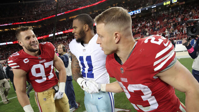 SANTA CLARA, CA - JANUARY 22: Nick Bosa #97 and Christian McCaffrey #23 of the San Francisco 49ers with Micah Parsons #11 of the Dallas Cowboys on the field after the NFC Divisional playoff game at Levi's Stadium on January 22, 2023 in Santa Clara, California. The 49ers defeated the Cowboys 19-12.