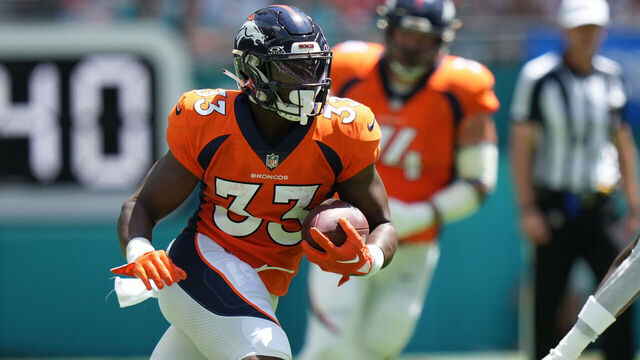 MIAMI GARDENS, FL - SEPTEMBER 24: Denver Broncos running back Javonte Williams (33) rushes after breaking multiple tackles during the game between the Denver Broncos and the Miami Dolphins on Sunday, September 24, 2023 at Hard Rock Stadium, Miami, Fla.