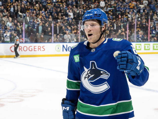 VANCOUVER, CANADA - OCTOBER 11: Brock Boeser #6 of the Vancouver Canucks heads to the bench to celebrate his goal during the first period of their NHL game against the the Edmonton Oilers at Rogers Arena October 11, 2023 in Vancouver, British Columbia, Canada.