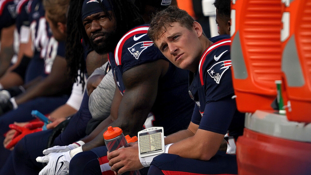 Foxborough, MA - October 8: New England Patriots QB Mac Jones sits on the bench in the fourth quarter. The Patriots lost to the New Orleans Saints, 34-0.