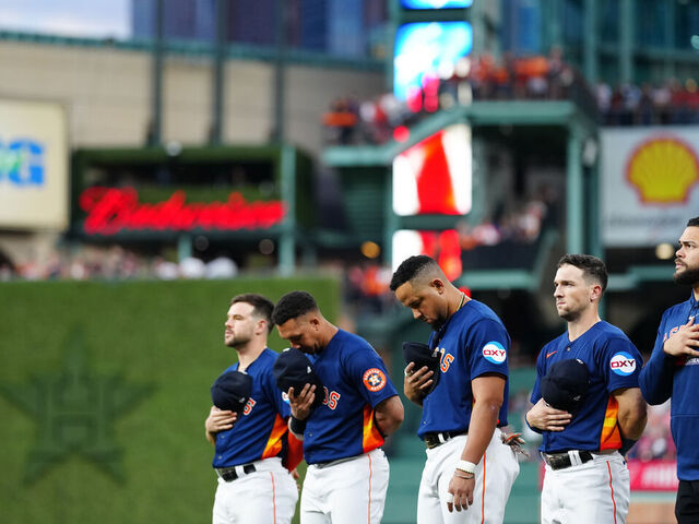 HOUSTON, TX - OCTOBER 08: Members of the Houston Astros stand for the national anthem prior to Game 2 of the Division Series between the Minnesota Twins and the Houston Astros at Minute Maid Park on Sunday, October 8, 2023 in Houston, Texas.