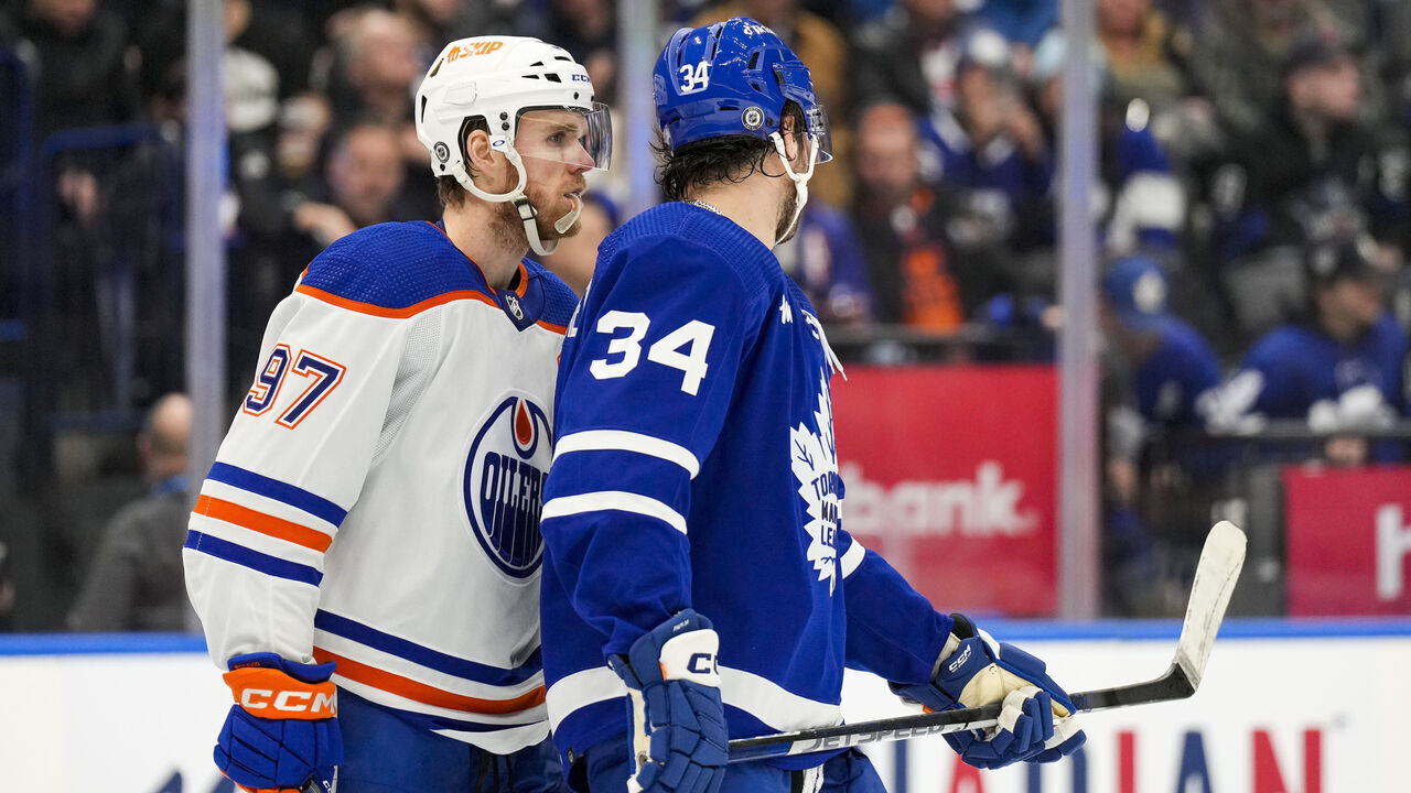 TORONTO, ON - MARCH 11: Connor McDavid #97 of the Edmonton Oilers skates along Auston Matthews #34 of the Toronto Maple Leafs during the second period at the Scotiabank Arena on March 11, 2023 in Toronto, Ontario, Canada.