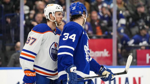 TORONTO, ON - MARCH 11: Connor McDavid #97 of the Edmonton Oilers skates along Auston Matthews #34 of the Toronto Maple Leafs during the second period at the Scotiabank Arena on March 11, 2023 in Toronto, Ontario, Canada.