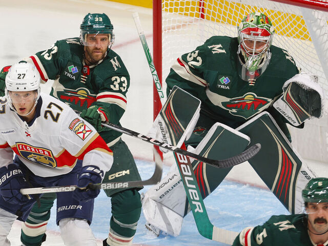 SAINT PAUL, MN - OCTOBER 12: Alex Goligoski #33 and Filip Gustavsson #32 of the Minnesota Wild defend against Eetu Luostarinen #27 of the Florida Panthers during the game at the Xcel Energy Center on October 12, 2023 in Saint Paul, Minnesota.