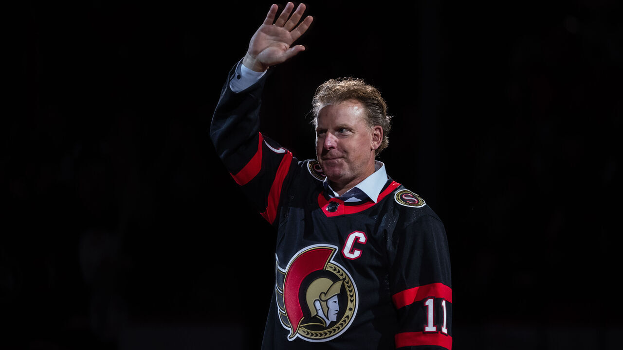 OTTAWA, ON - OCTOBER 18: Former Ottawa Senators player Daniel Alfredsson waves to the crowd prior to a ceremonial face-off before National Hockey League action between the Boston Bruins and Ottawa Senators on October 18, 2022, at Canadian Tire Centre in Ottawa, ON, Canada.