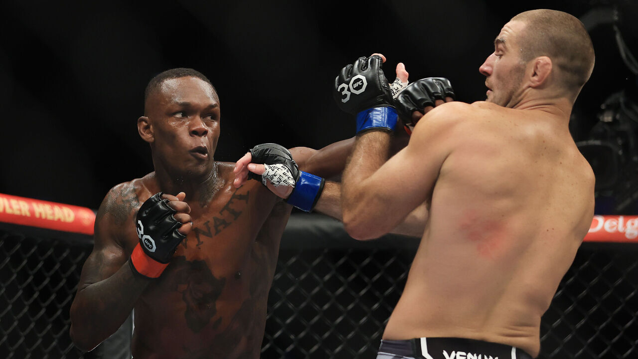 SYDNEY, AUSTRALIA - SEPTEMBER 10: Sean Strickland of United States trades punches with Israel Adesanya of Nigeria (L), during the UFC 293 event at Qudos Bank Arena on September 10, 2023 in Sydney, Australia.