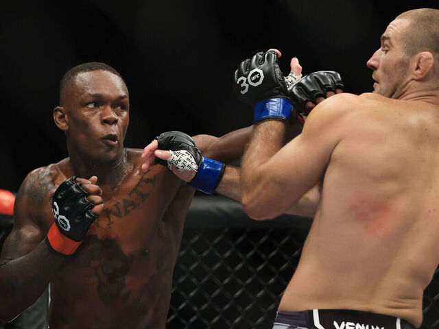 SYDNEY, AUSTRALIA - SEPTEMBER 10: Sean Strickland of United States trades punches with Israel Adesanya of Nigeria (L), during the UFC 293 event at Qudos Bank Arena on September 10, 2023 in Sydney, Australia.