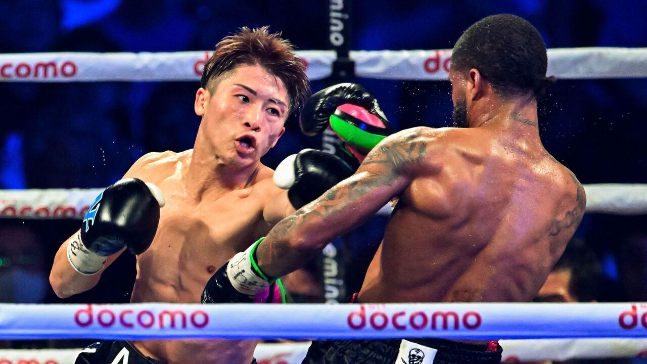 Naoya Inoue of Japan (L) and Stephen Fulton of the US fight in the WBC, WBO super bantamweight world title match at Ariake Arena in Tokyo on July 25, 2023.