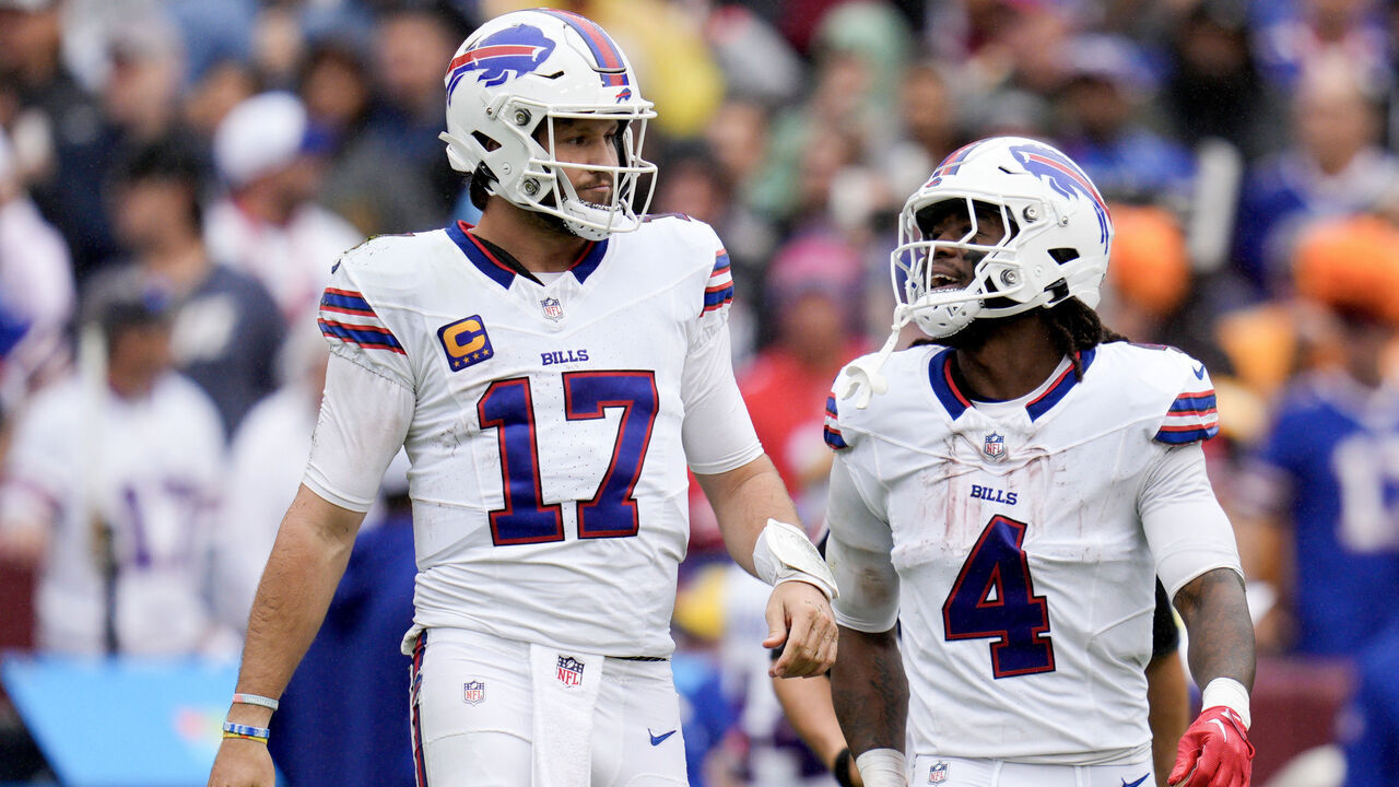 LANDOVER, MARYLAND - SEPTEMBER 24: Josh Allen #17 of the Buffalo Bills talks with James Cook #4 after getting a first down against the Washington Commanders during the first half at FedExField on September 24, 2023 in Landover, Maryland.