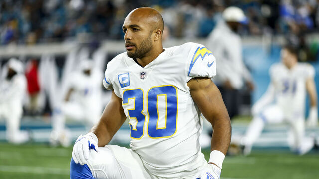 JACKSONVILLE, FL - JANUARY 14: Austin Ekeler #30 of the Los Angeles Chargers stretches prior to an NFL wild card playoff football game against the Jacksonville Jaguars at TIAA Bank Field on January 14, 2023 in Jacksonville, Florida.