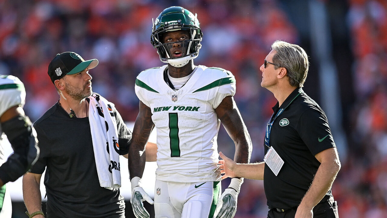 DENVER, CO - OCTOBER 8: New York Jets cornerback Sauce Gardner (1) walks off the field with trainers after a play during a game between the New York Jets and the Denver Broncos at Empower Field at Mile High on October 8, 2023 in Denver, Colorado.