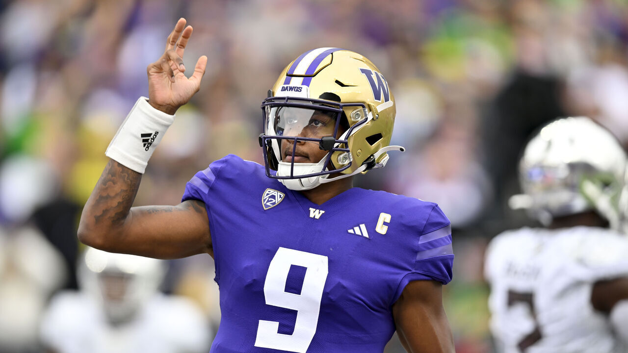 SEATTLE, WASHINGTON - OCTOBER 14: Michael Penix Jr. #9 of the Washington Huskies waves during the first quarter against the Oregon Ducks at Husky Stadium on October 14, 2023 in Seattle, Washington.