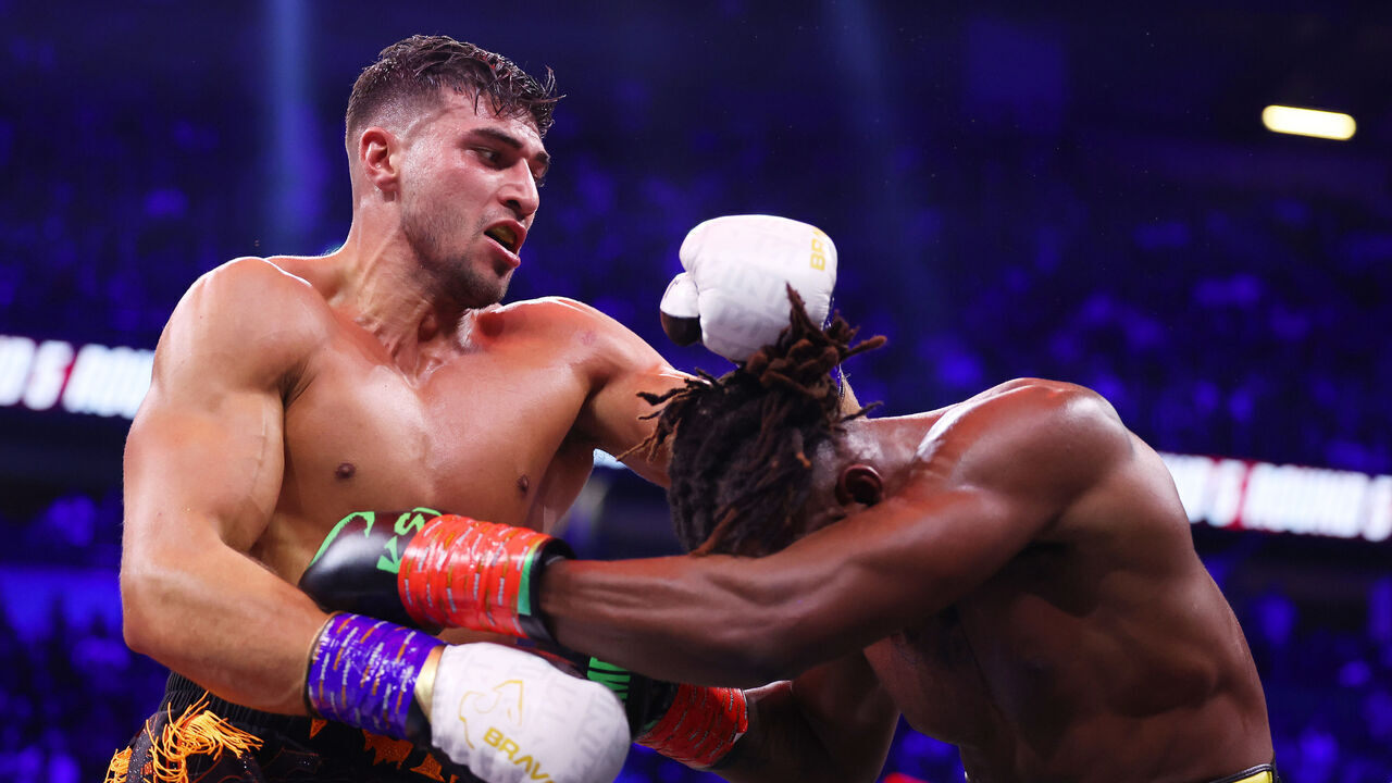 MANCHESTER, ENGLAND - OCTOBER 14: Tommy Fury punches KSI (Olajide Olayinka Williams) during the Misfits Cruiserweight fight between KSI (Olajide Olayinka Williams) and Tommy Fury at AO Arena on October 14, 2023 in Manchester, England.