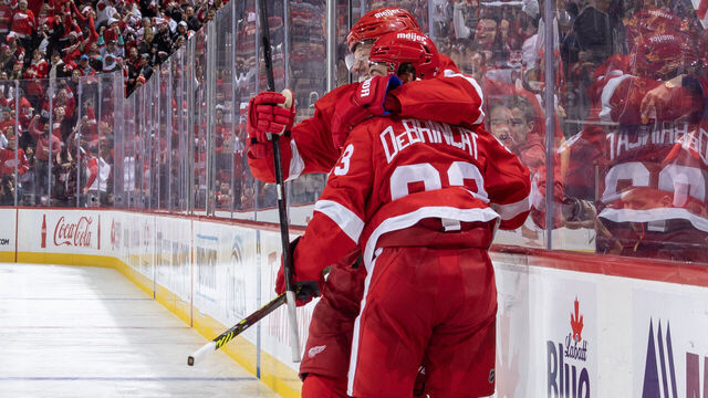 DETROIT, MI - OCTOBER 14: Alex DeBrincat #93 of the Detroit Red Wings celebrates his goal against the Tampa Bay Lightning with teammate Lucas Raymond #23 of the Detroit Red Wings in the third period of the home opener at Little Caesars Arena on October 14, 2023 in Detroit, Michigan. Detroit defeated Tampa Bay 6-4.