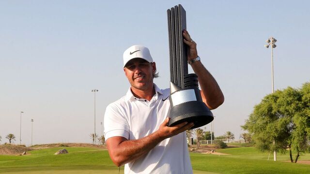 Brooks Koepka of the US celebrates his trophy after winning the 2023 LIV Golf Jeddah champion at Royal Greens Golf in Jeddah on October 15, 2023.