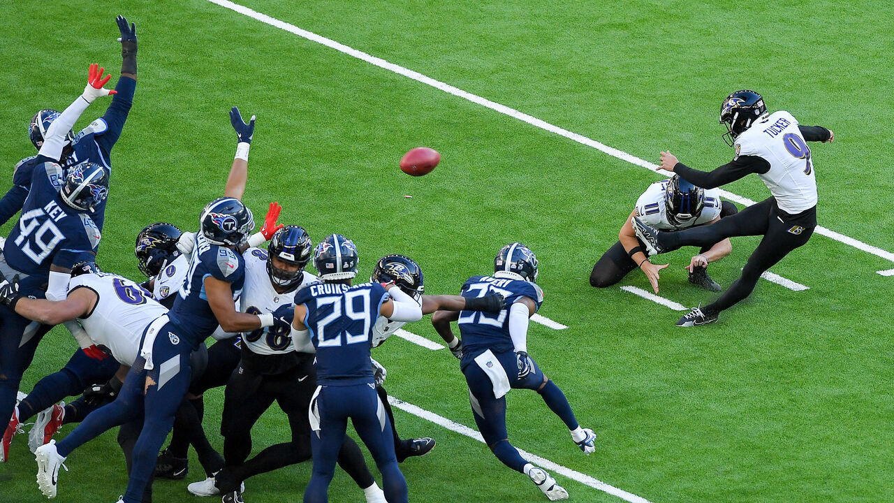 LONDON, ENGLAND - OCTOBER 15: Justin Tucker of Baltimore Ravens controls the ball during the NFL match between Baltimore Ravens and Tennessee Titans at Tottenham Hotspur Stadium on October 15, 2023 in London, England.