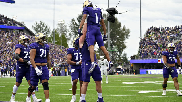 SEATTLE, WASHINGTON - OCTOBER 14: Rome Odunze #1 of the Washington Huskies celebrates with teammates after scoring a touchdown during the third quarter against the Oregon Ducks at Husky Stadium on October 14, 2023 in Seattle, Washington. The Washington Huskies won 36-33.