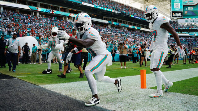 MIAMI GARDENS, FLORIDA - OCTOBER 15: Tyreek Hill #10 of the Miami Dolphins celebrates a touchdown during the first half in the game against the Carolina Panthers at Hard Rock Stadium on October 15, 2023 in Miami Gardens, Florida.