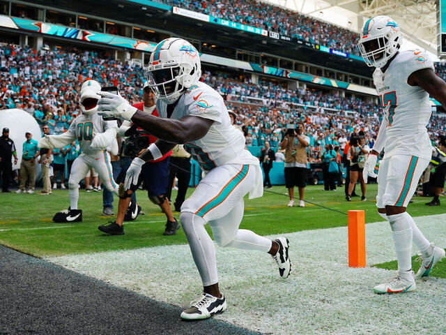 MIAMI GARDENS, FLORIDA - OCTOBER 15: Tyreek Hill #10 of the Miami Dolphins celebrates a touchdown during the first half in the game against the Carolina Panthers at Hard Rock Stadium on October 15, 2023 in Miami Gardens, Florida.