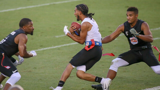HOUSTON, TX - JULY 19: Godspeed flex Jarrin Soloman (5) reaches to pull a flag from Fighting Cancer wide receiver Darius Davis (4) during the American Flag Football League Ultimate Final game between the Fighting Cancer and Godspeed on July 19, 2018 at BBVA Compass Stadium in Houston, Texas.