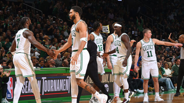 BOSTON, MA - OCTOBER 8: Jaylen Brown #7, Jayson Tatum #0 and Jrue Holiday #4 of the Boston Celtics celebrates against the Philadelphia 76ers on October 8, 2023 at the TD Garden in Boston, Massachusetts. Mandatory Copyright Notice: Copyright 2023 NBAE