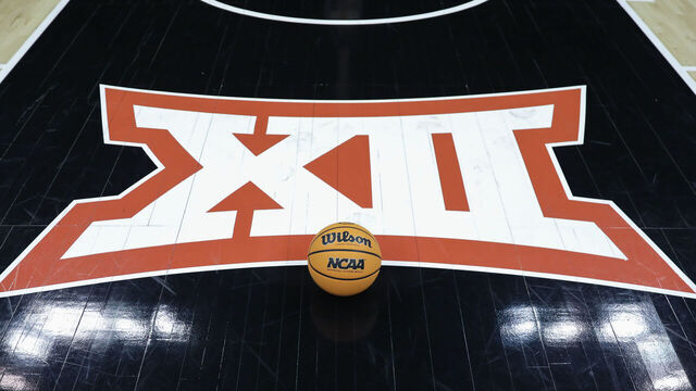 KANSAS CITY, MO - MARCH 10: A view of the Big 12 logo and an NCAA basketball on the floor before Big 12 Tournament semifinal basketball game between the Iowa State Cyclones and Kansas Jayhawks on March 10, 2023 at T-Mobile Center in Kansas City, MO.