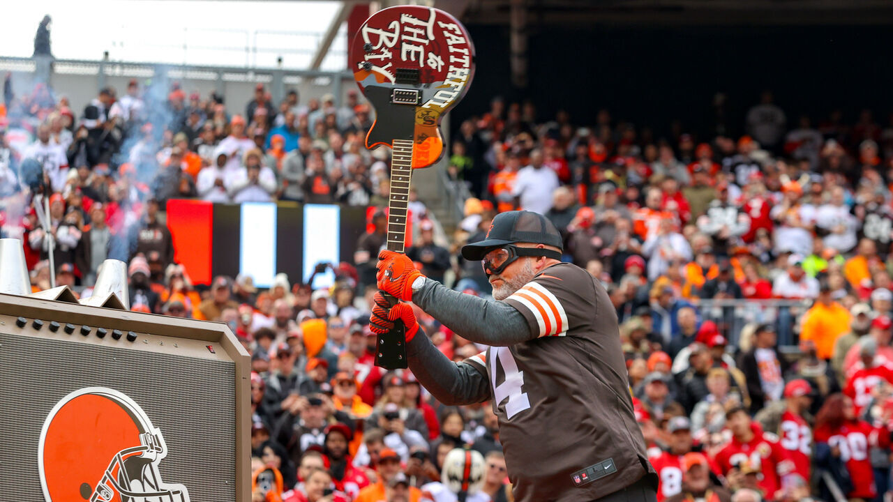 CLEVELAND, OH - OCTOBER 15: Cleveland Browns great Phil Dawson breaks a custom painted San Francisco 49ers guitar prior to the National Football League game between the San Francisco 49ers and Cleveland Browns on October 15, 2023, at Cleveland Browns Stadium in Cleveland, OH.