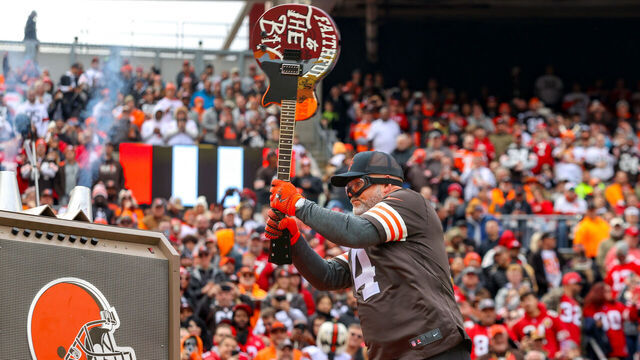 CLEVELAND, OH - OCTOBER 15: Cleveland Browns great Phil Dawson breaks a custom painted San Francisco 49ers guitar prior to the National Football League game between the San Francisco 49ers and Cleveland Browns on October 15, 2023, at Cleveland Browns Stadium in Cleveland, OH.