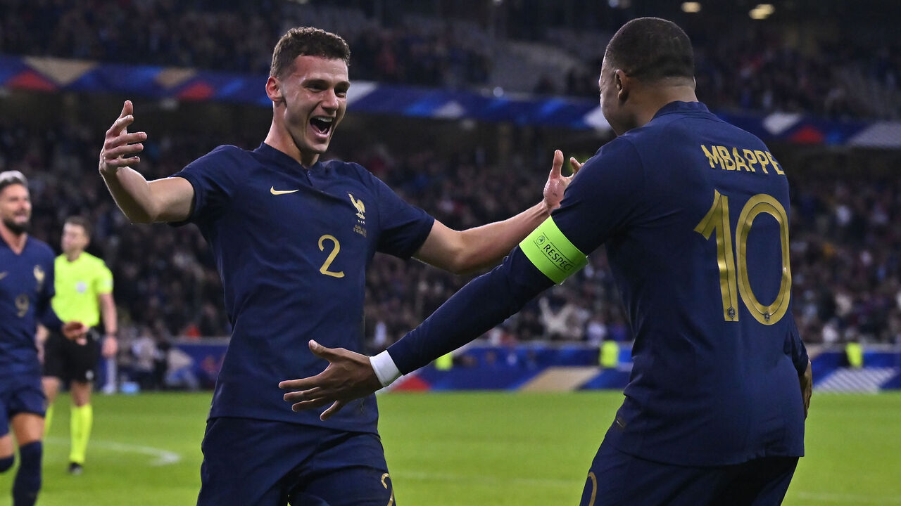 LILLE, FRANCE - OCTOBER 17: Benjamin Pavard of France celebrates with teammate Kylian Mbappe after scoring during the international friendly match between France and Scotland at Decathlon Arena on October 17, 2023 in Lille, France.