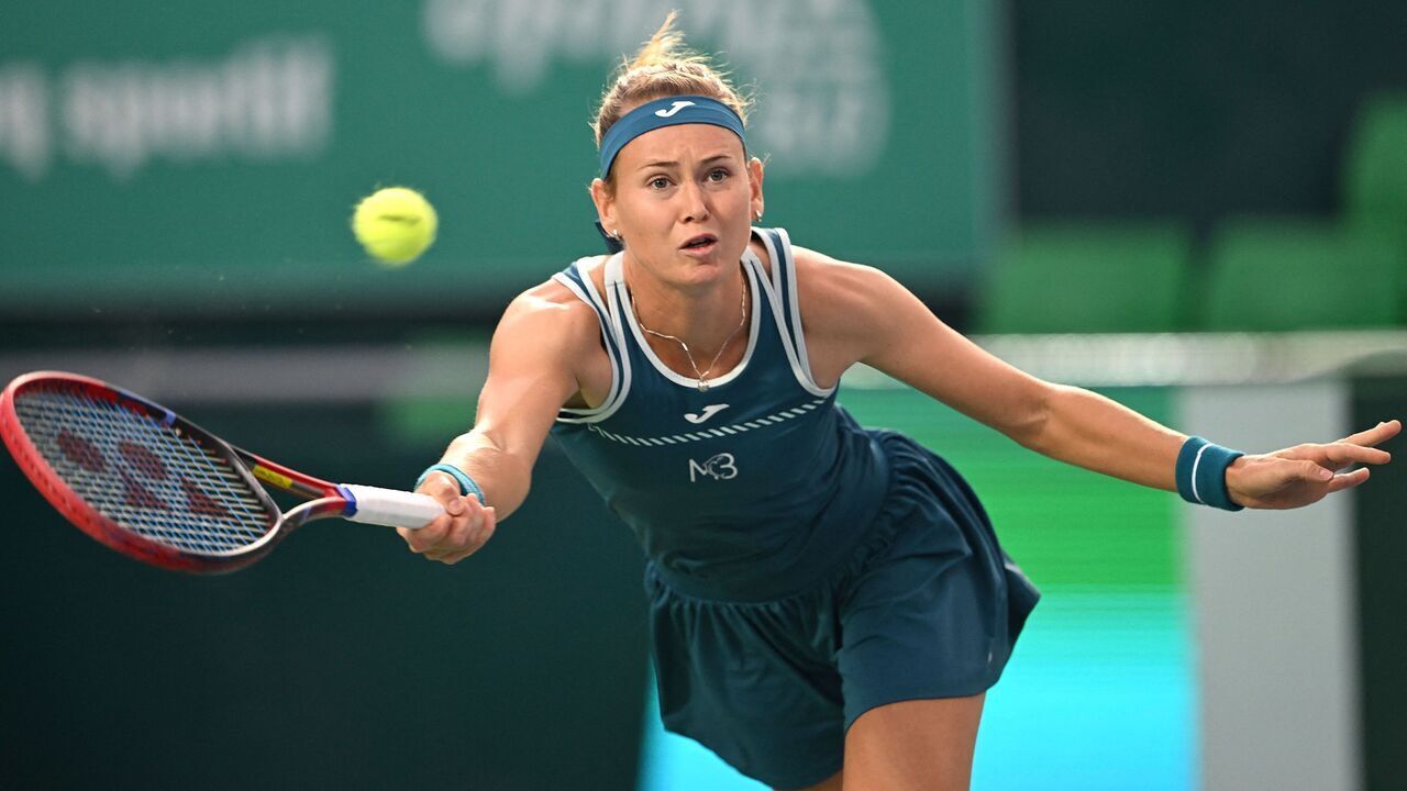 Czech Republic's Marie Bouzkova hits a return against China's Yuan Yue during their women's singles quarter-final match at the Korea Open tennis championships in Seoul on October 13, 2023.