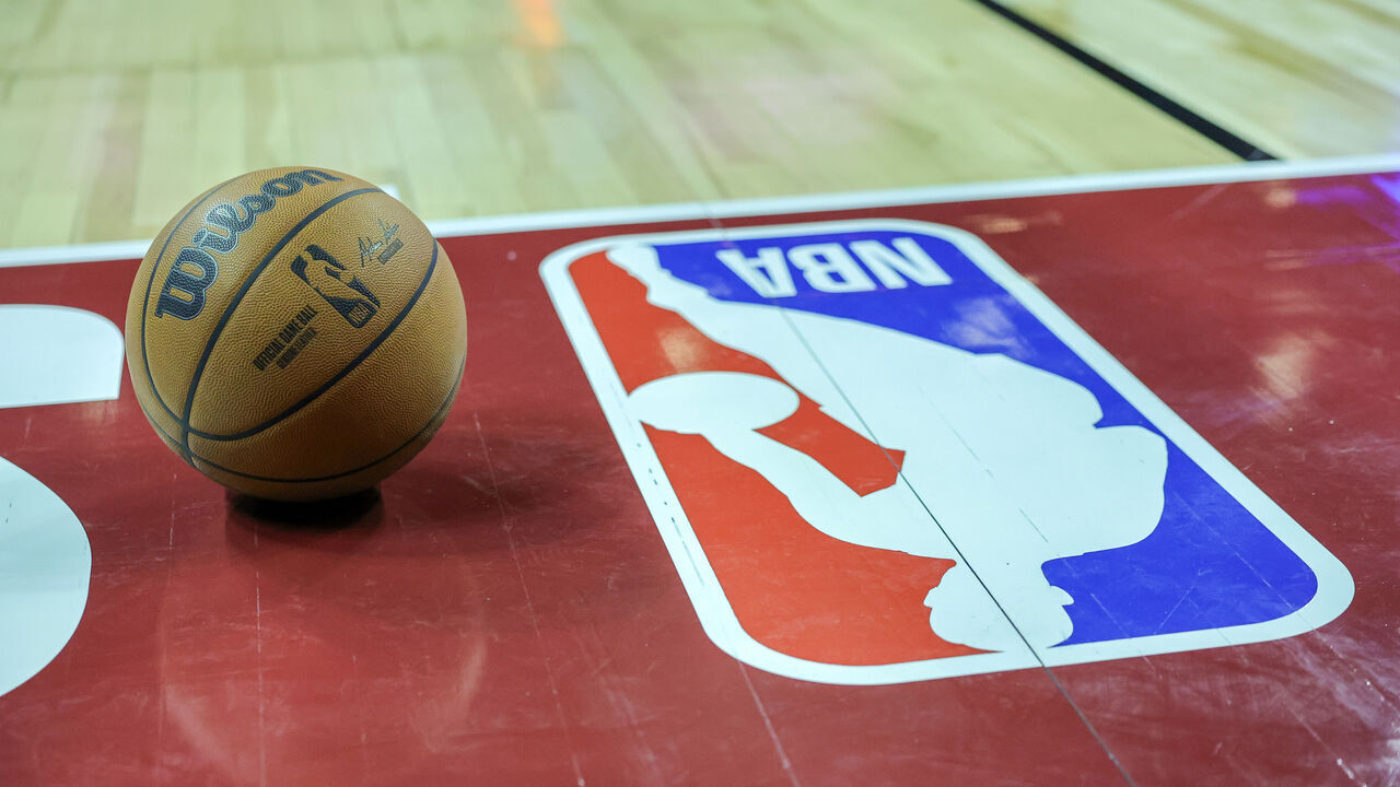 LAS VEGAS, NEVADA - JULY 07: A basketball is placed on the court next to an NBA logo during a break in the first half of a 2023 NBA Summer League game between the Portland Trail Blazers and the Houston Rockets at the Thomas & Mack Center on July 07, 2023 in Las Vegas, Nevada.