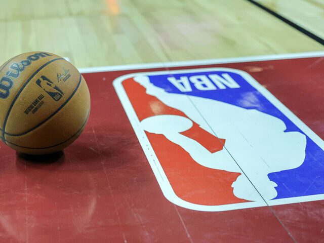 LAS VEGAS, NEVADA - JULY 07: A basketball is placed on the court next to an NBA logo during a break in the first half of a 2023 NBA Summer League game between the Portland Trail Blazers and the Houston Rockets at the Thomas & Mack Center on July 07, 2023 in Las Vegas, Nevada.