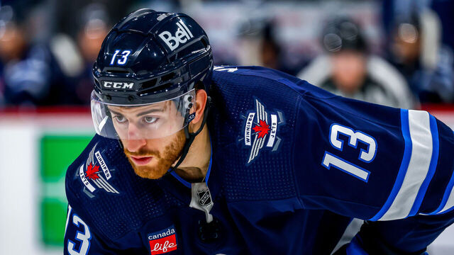 WINNIPEG, CANADA - OCTOBER 14: Gabriel Vilardi #13 of the Winnipeg Jets prepares for a second period face-off against the Florida Panthers at Canada Life Centre on October 14, 2023 in Winnipeg, Manitoba, Canada.