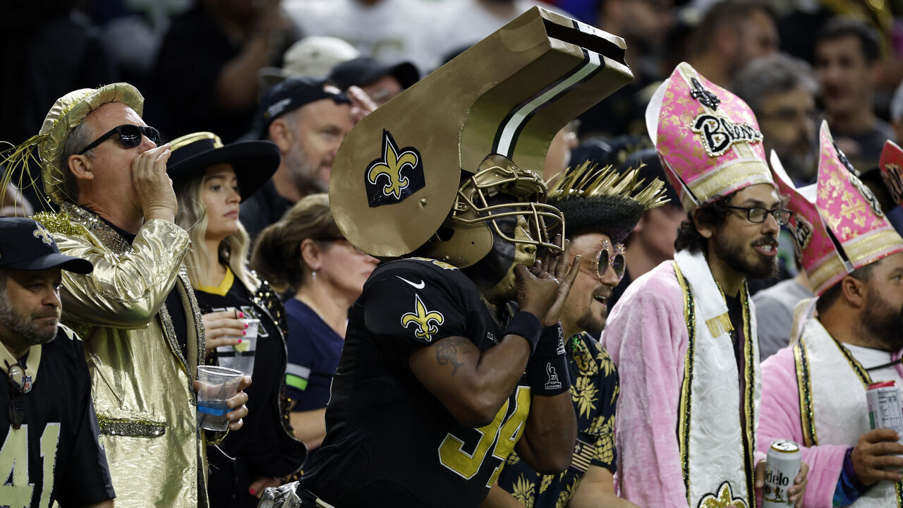 NEW ORLEANS, LOUISIANA - OCTOBER 09: Fans cheer for the New Orleans Saints at Caesars Superdome on October 09, 2022 in New Orleans, Louisiana.